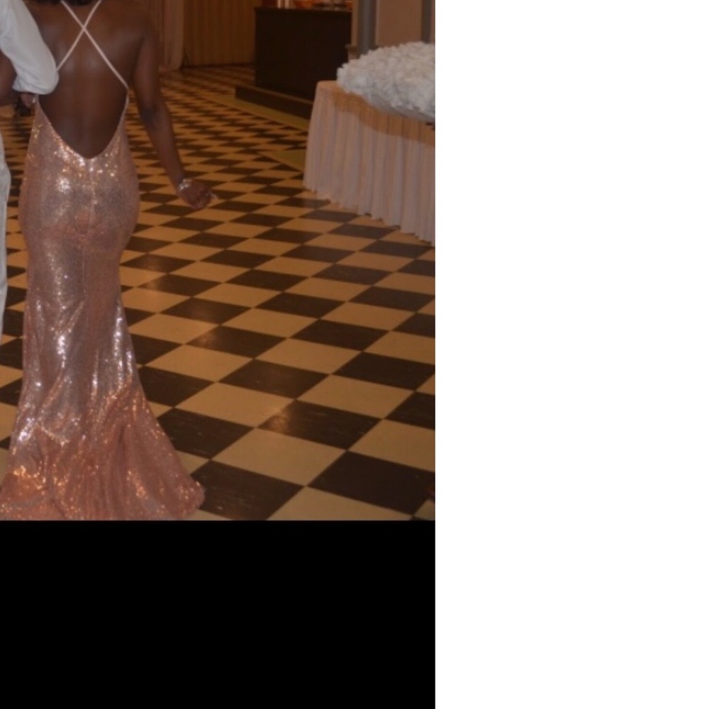 A mermaid rose gold prom dress